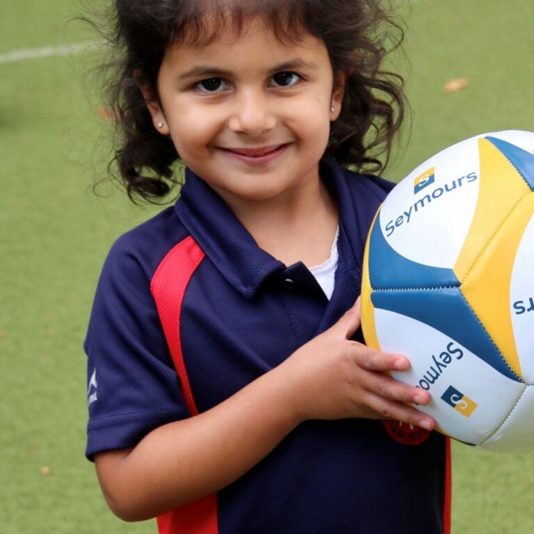 girl holding a ball